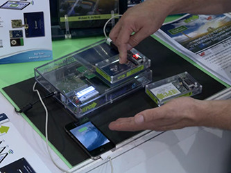 EPC engineers demonstrate the capabilities of the EPC9121 multi-mode wireless power charging kit at PCIM Asia 2016